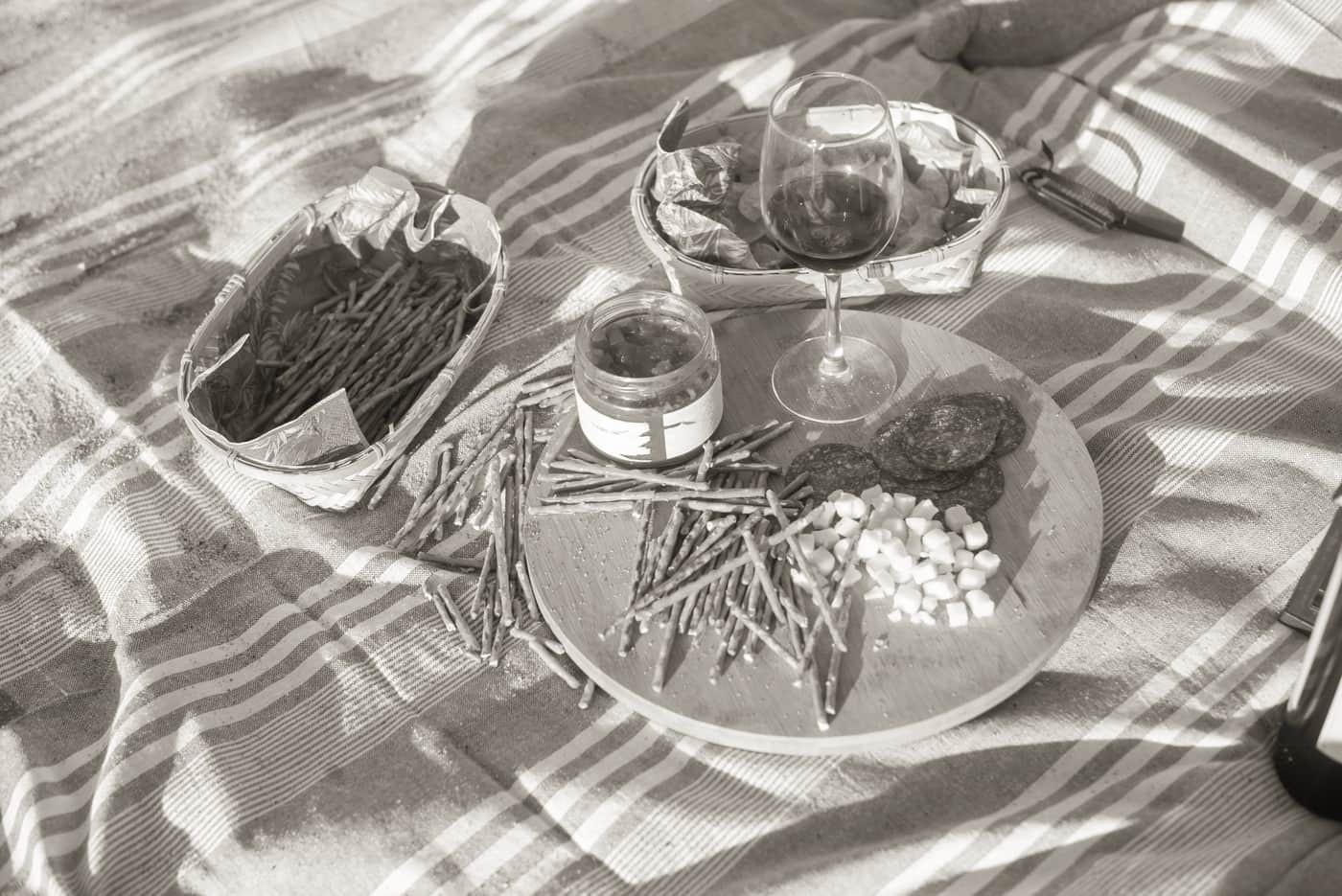 A charcuterie gift basket with a board
