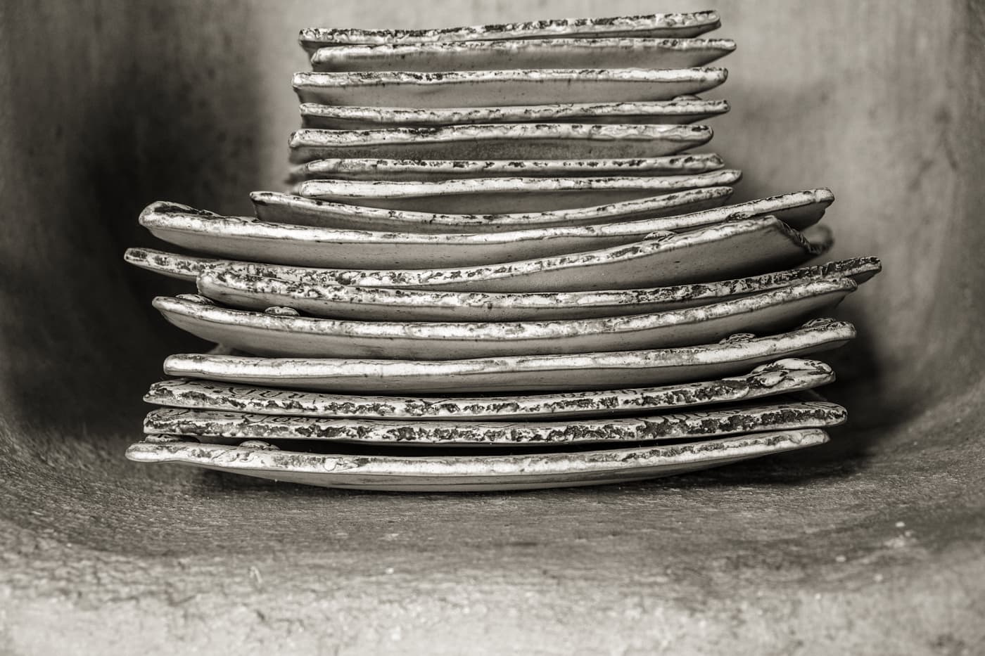 A stack of ceramic dinner plates