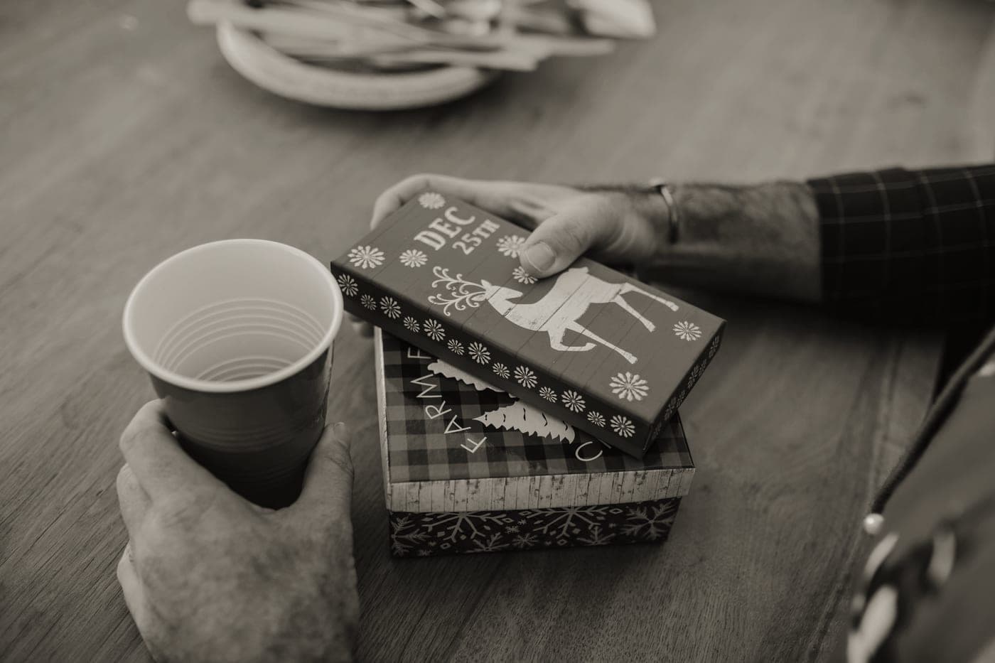 A wrapped gift being held in two hands