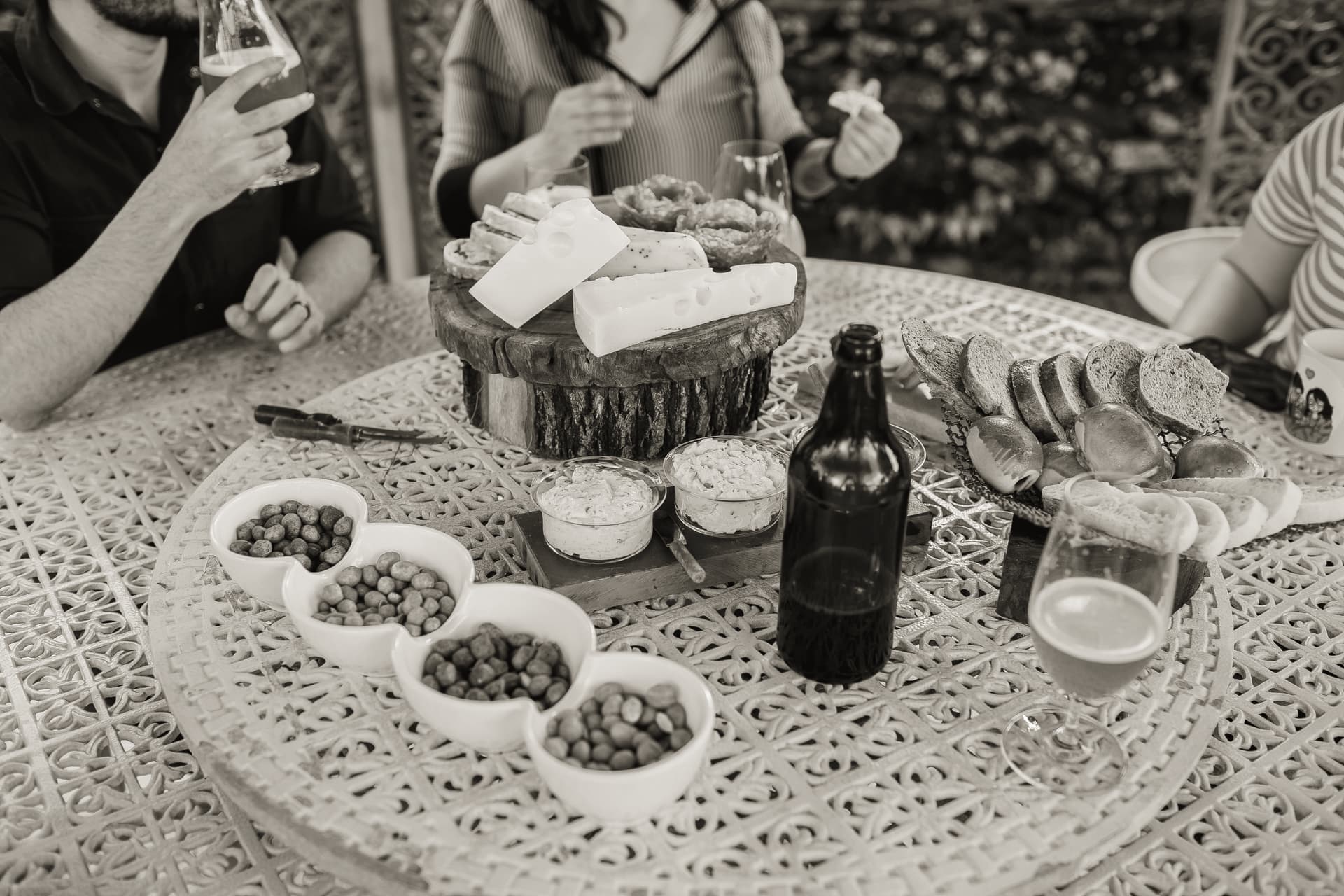 A charcuterie board set out on a patio table outdoors