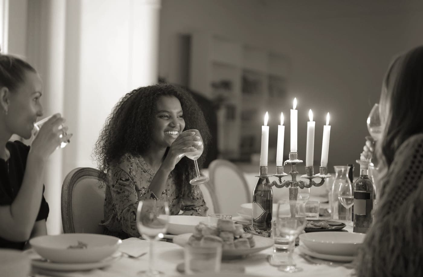 A table set with food and candles for a dinner party