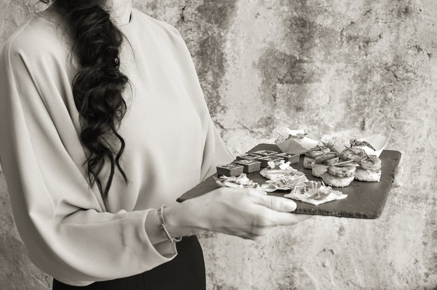 A serving tray of canapes being passed at a party