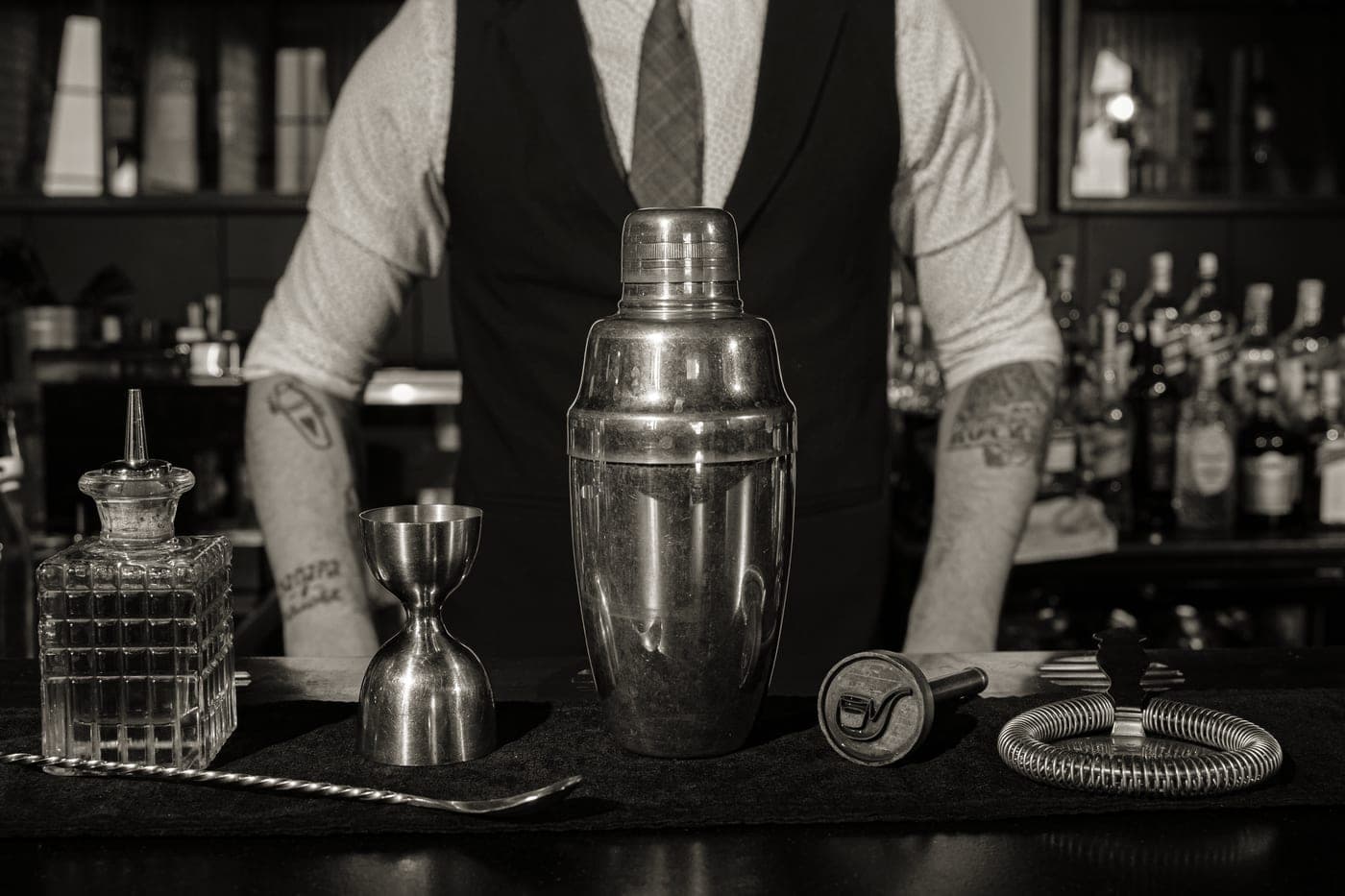 A cocktail shaker being used to mix a drink