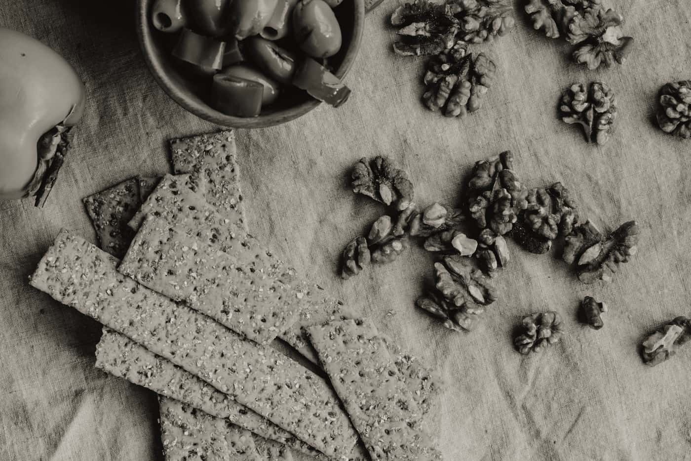 Bowls of nuts, olives and crackers set out as snacks