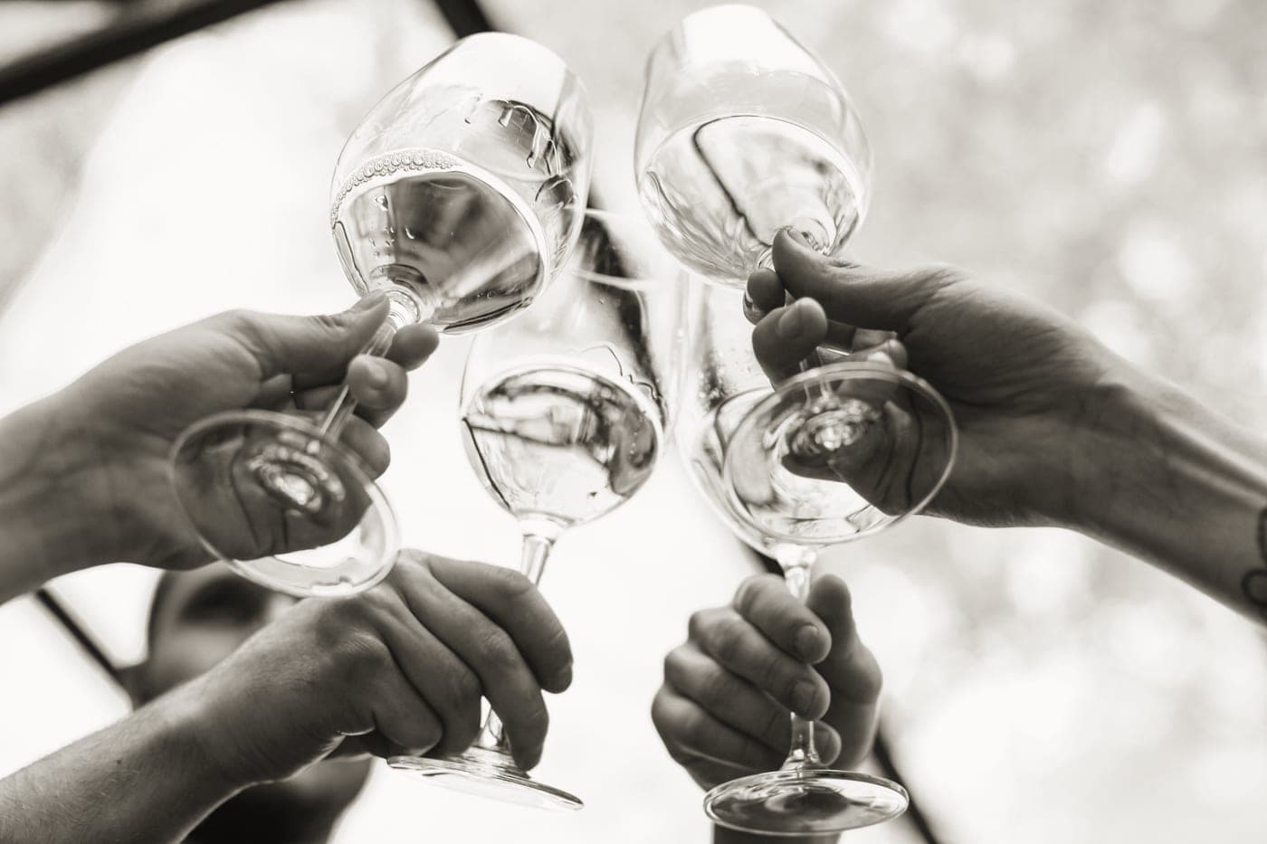 A stemless wine glass held in one hand